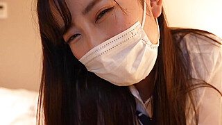 Japanese girl gives a guy a handjob wearing a sailor suit Porn Video